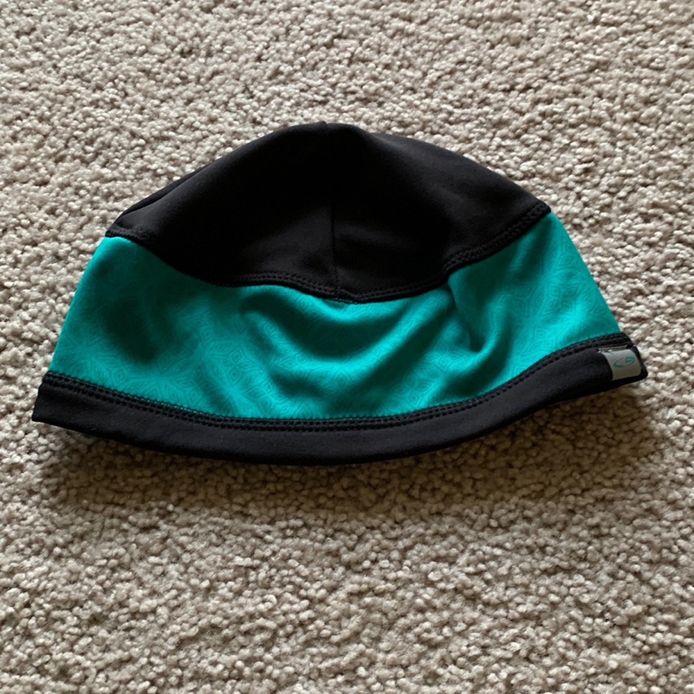 Black and teal hat gently used